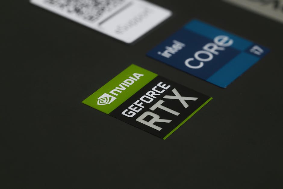 Steam Mart 2026 anketi: Intel ve AMD işlemci paylarında dramatik değişim — Close-up of NVIDIA GeForce RTX and Intel Core i7 stickers on a laptop surface, s