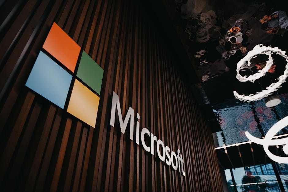 Microsoft Teams AI Özet Özelliği Mayıs 2026'da Kayıt Tutmadan Geliyor — Interior view of Microsoft office with logo on wooden wall in Brussels, Belgium.